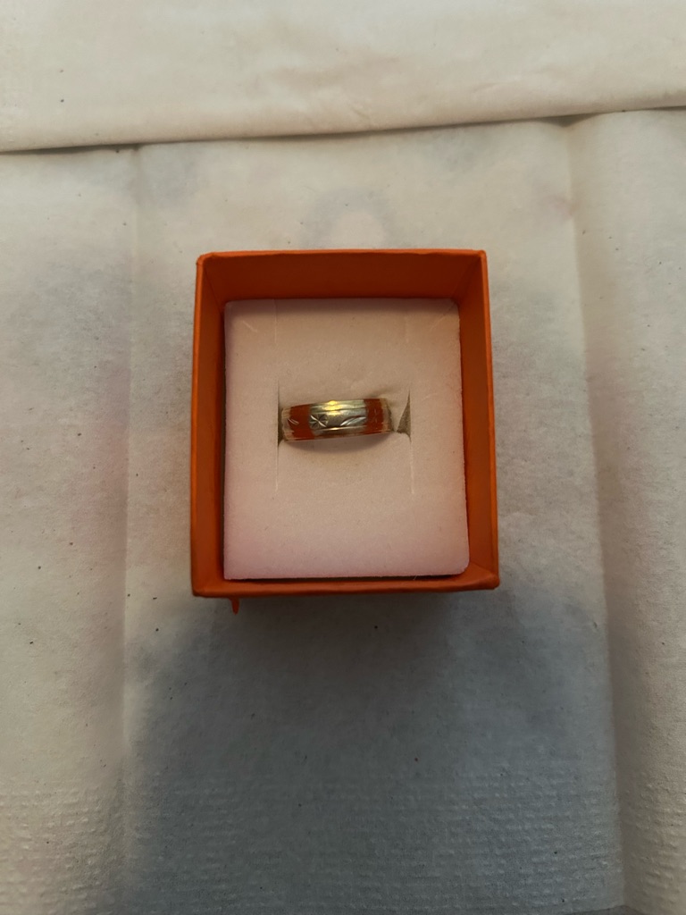 14 carat gold band ring photographed against white for a retailer product listing